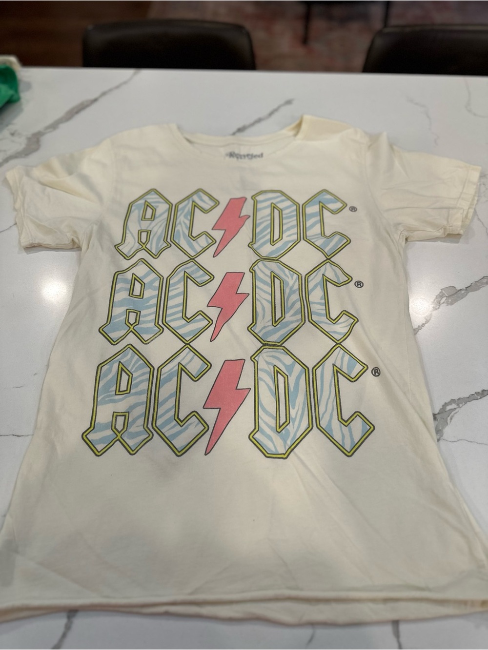 AC/DC Cream Tee with Pink Lightning and Blue Graphic